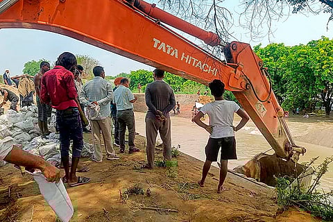 Repair work underway on the breached portion
